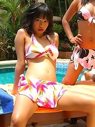 Asian lesbians kissing by the pool Asian lesbians kissing by the pool