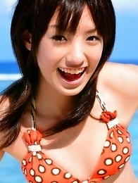 Akina Minami in colorful bath suits plays with big ball Akina Minami in colorful bath suits plays with big ball